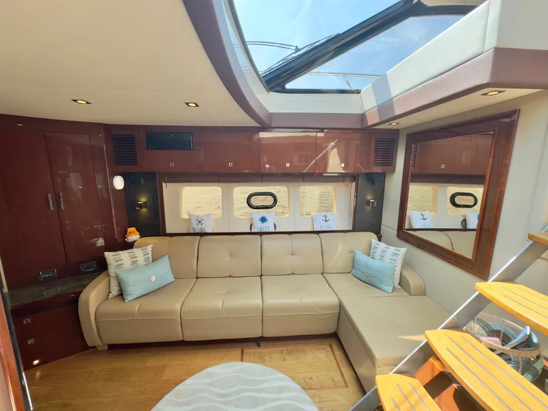 Slide: The Image of Luxurious interior of 2014 Sea Ray 510 Sundancer yacht with beige leather seating. - 34