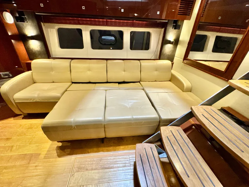 Slide: The Image of Luxurious interior of 2014 Sea Ray 510 Sundancer yacht with beige leather seating. - 35