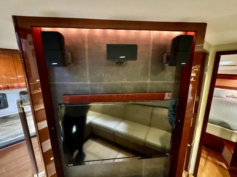 Slide: The Image of Luxurious interior of 2014 Sea Ray 510 Sundancer with modern entertainment system. - 38