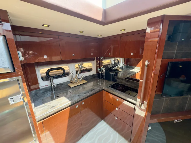 Slide: The Image of Luxurious kitchen interior of 2014 Sea Ray 510 Sundancer yacht with modern amenities. - 39