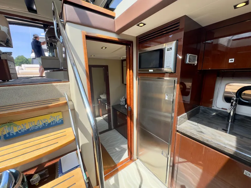 Slide: The Image of Interior of 2014 Sea Ray 510 Sundancer yacht with modern kitchen and stairs. - 40