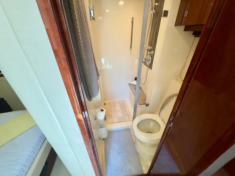 Slide: The Image of Luxurious bathroom in 2014 Sea Ray 510 Sundancer yacht, featuring shower and toilet. - 44