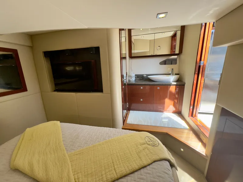 Slide: The Image of Luxurious interior of 2014 Sea Ray 510 Sundancer yacht with elegant bedroom and bathroom. - 48