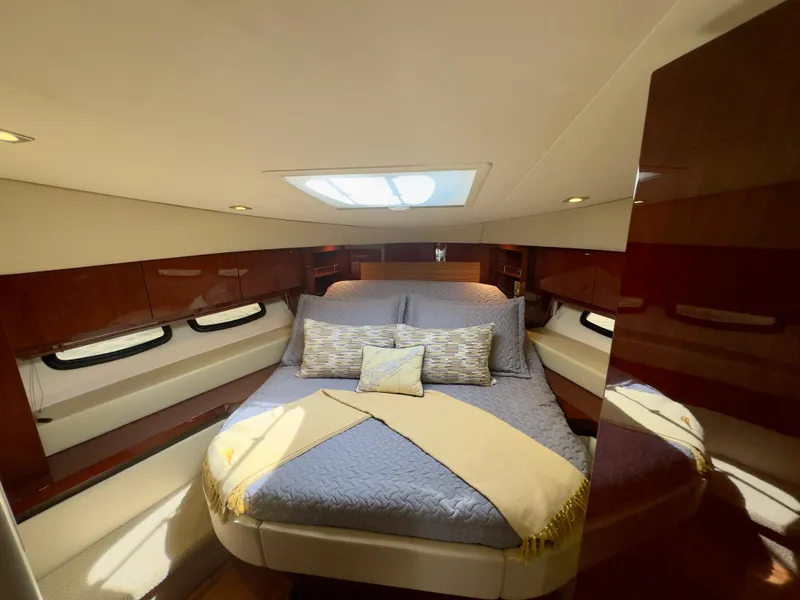 Slide: The Image of Luxurious bedroom interior of 2014 Sea Ray 510 Sundancer yacht with elegant bedding. - 49