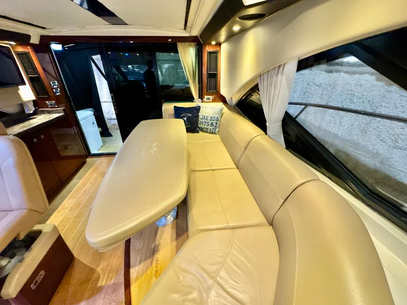 Slide: The Image of Luxurious interior of 2014 Sea Ray 510 Sundancer yacht with beige leather seating. - 58