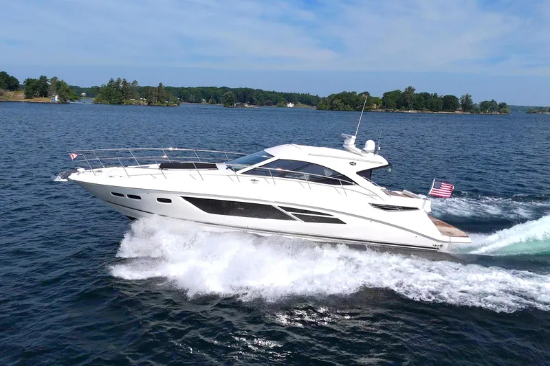 Slide: The Image of 2014 Sea Ray 510 Sundancer yacht cruising on open water. - 9