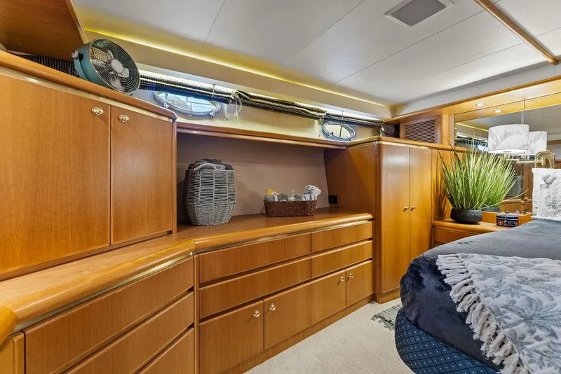 Slide: The Image of Luxurious interior of 2000 West Bay 58 Sonship yacht with elegant wood cabinetry. - 21