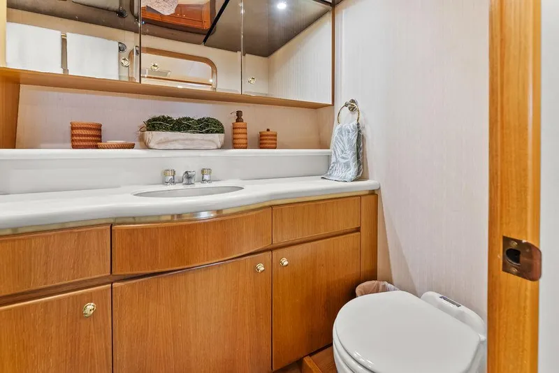 Slide: The Image of Luxurious bathroom in 2000 West Bay 58 Sonship yacht with wooden cabinetry and modern fixtures. - 23