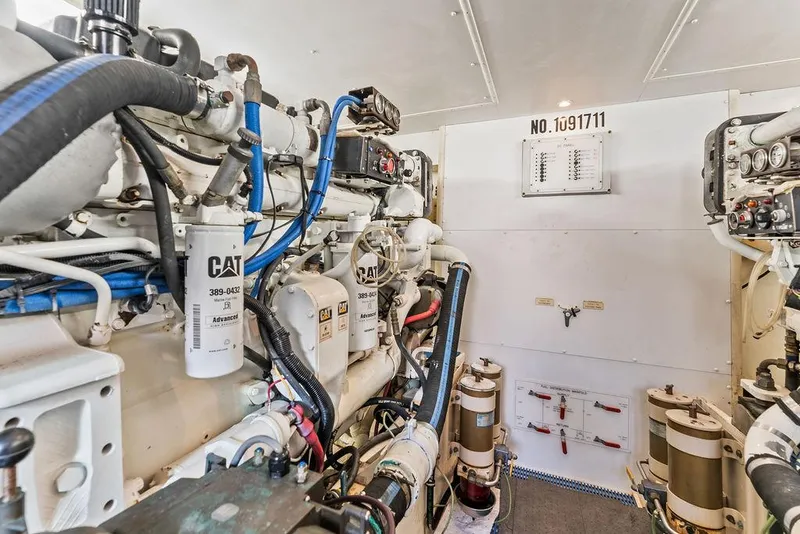 Slide: The Image of Engine room of 2000 West Bay 58 Sonship yacht, featuring CAT machinery and equipment. - 39