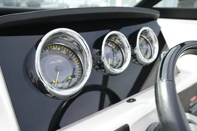 Slide: The Image of Dashboard gauges of a 2021 Sea Ray SPX 230 boat. - 12
