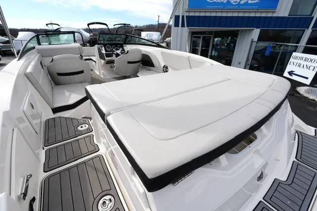 Slide: The Image of 2021 Sea Ray SPX 230 boat with spacious seating and modern design. - 14