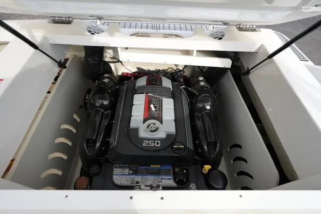 Slide: The Image of Engine compartment of 2021 Sea Ray SPX 230 boat, featuring a powerful 250 horsepower engine. - 15