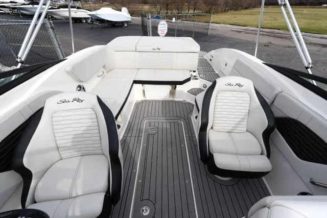 Slide: The Image of 2021 Sea Ray SPX 230 boat interior with white seating and sleek design. - 6
