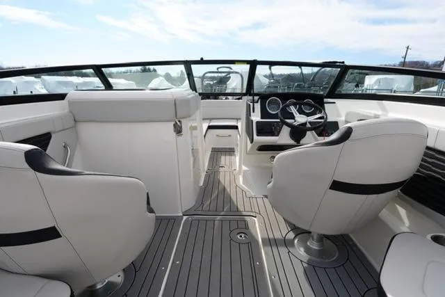Slide: The Image of Interior of 2021 Sea Ray SPX 230 boat with modern seating and dashboard. - 9