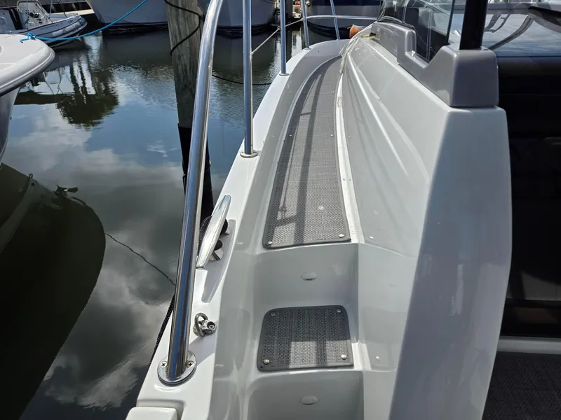 Slide: The Image of 2022 Jeanneau Leader 10.5 WA S2 boat deck, docked at marina. - 10