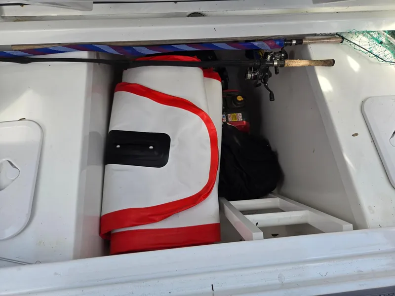 Slide: The Image of Storage compartment on a 2022 Jeanneau Leader 10.5 WA S2 boat with fishing gear. - 13