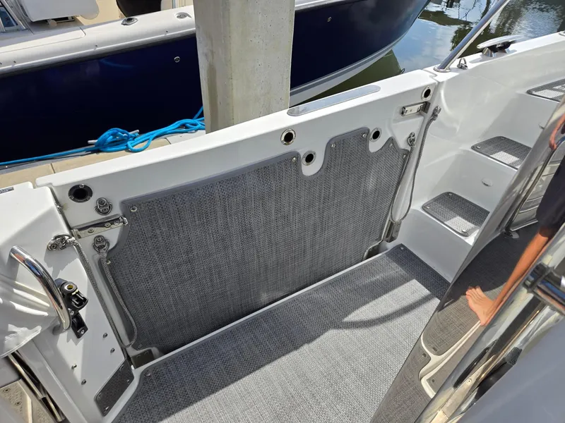 Slide: The Image of 2022 Jeanneau Leader 10.5 WA S2 boat interior with steps and deck details. - 9