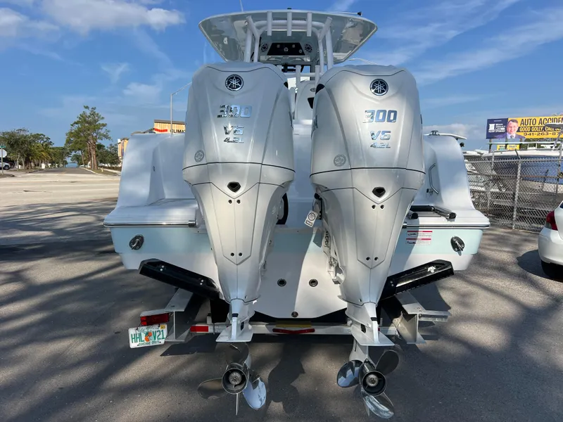 Slide: The Image of 2025 Sportsman Open 302 Center Console with twin 300 V6 engines, rear view. - 5