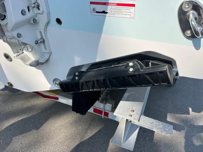 Slide: The Image of 2025 Sportsman Open 302 Center Console boat on trailer, close-up of rear section. - 6