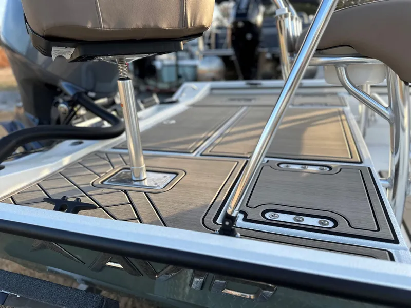 Slide: The Image of 2025 Avid Rogue 20 CC boat deck with sleek seating and modern design. - 2