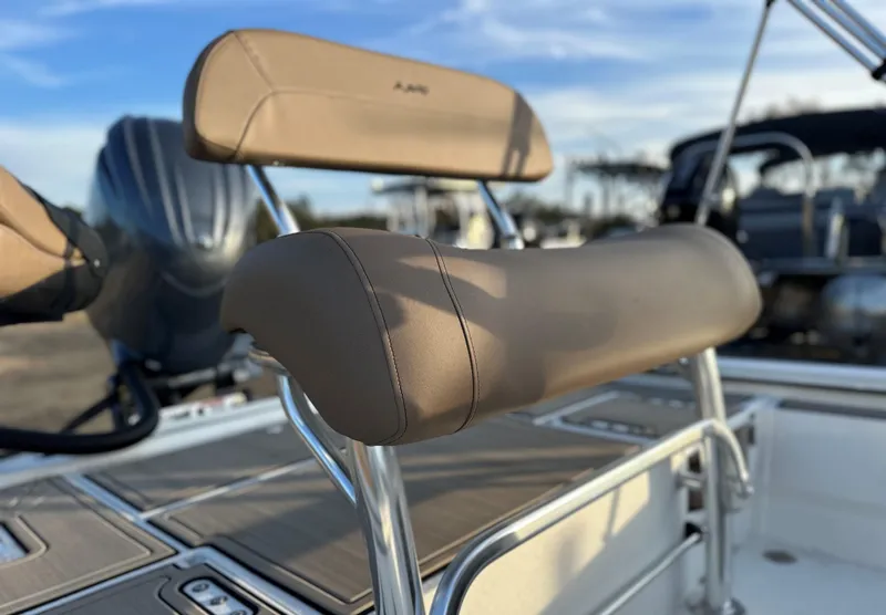 Slide: The Image of 2025 Avid Rogue 20 CC boat seat with tan upholstery and stainless steel frame. - 3