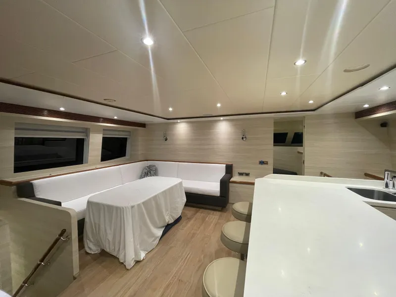 Slide: The Image of Luxurious interior of 2017 Horizon PC60 yacht with modern seating and elegant lighting. - 10