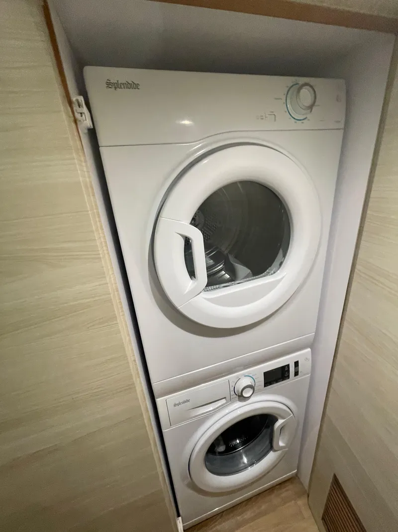 Slide: The Image of Stacked washer and dryer in a compact laundry space, Horizon PC60, 2017 model. - 14