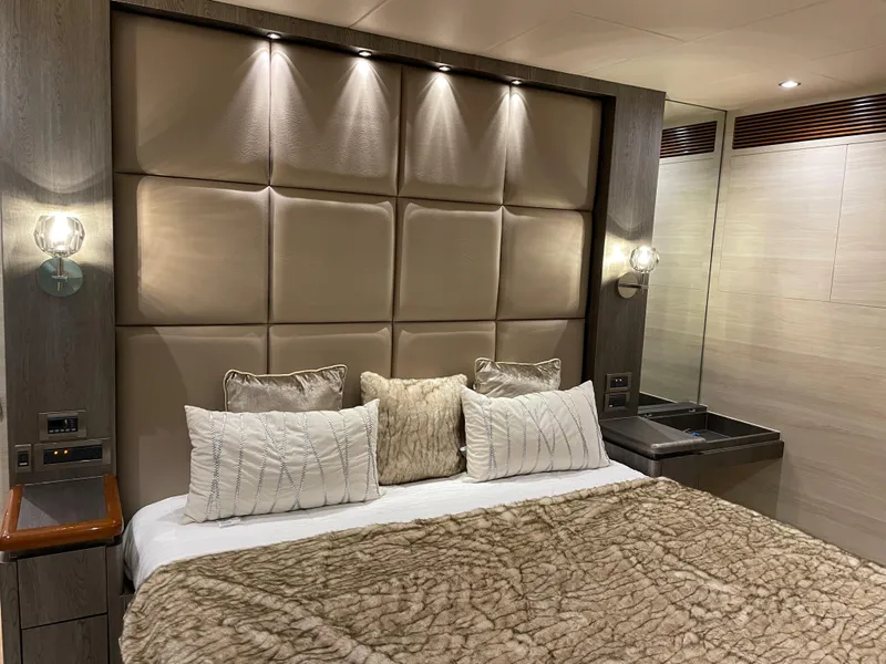 Slide: The Image of Luxurious bedroom interior in 2017 Horizon PC60 yacht with plush bedding and modern lighting. - 2