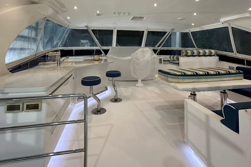 Slide: The Image of Luxurious interior of 2017 Horizon PC60 yacht with modern seating and bar stools. - 22