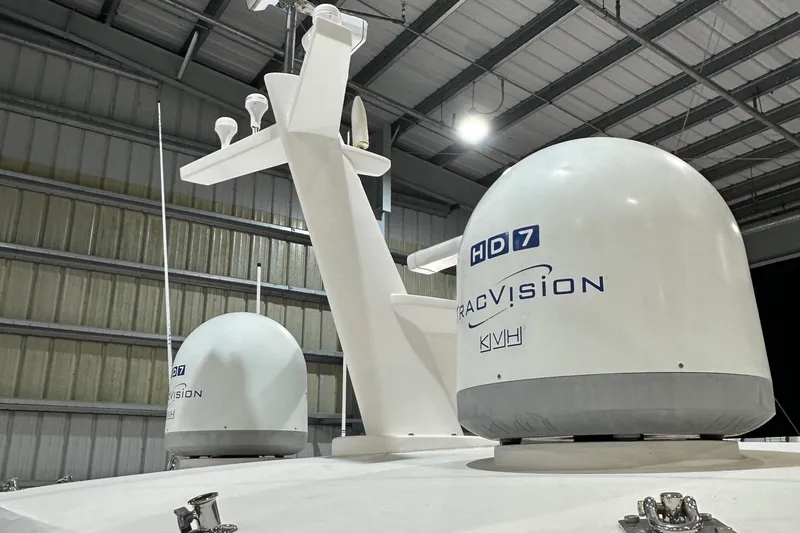Slide: The Image of Satellite domes on Horizon PC60 yacht, 2017 model, in a warehouse setting. - 24