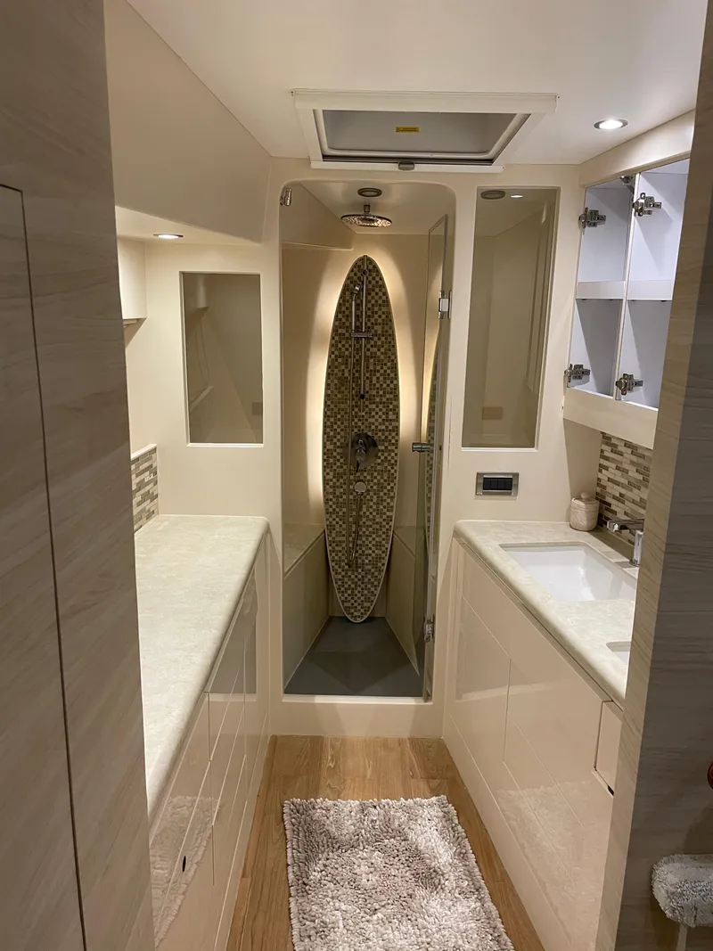 Slide: The Image of Luxurious bathroom in 2017 Horizon PC60 yacht, featuring modern fixtures and elegant design. - 29
