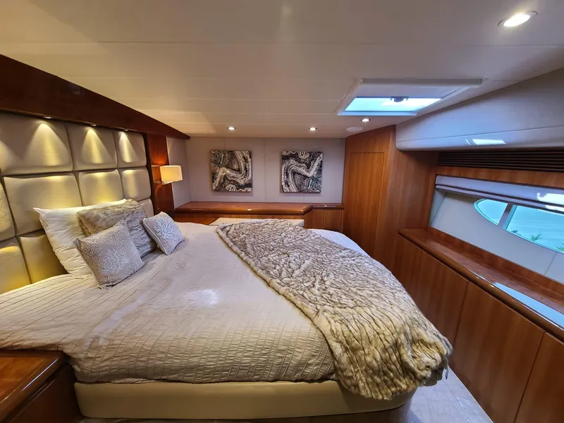 Slide: The Image of Luxurious bedroom interior on a 2017 Horizon PC60 yacht with elegant bedding and modern decor. - 4
