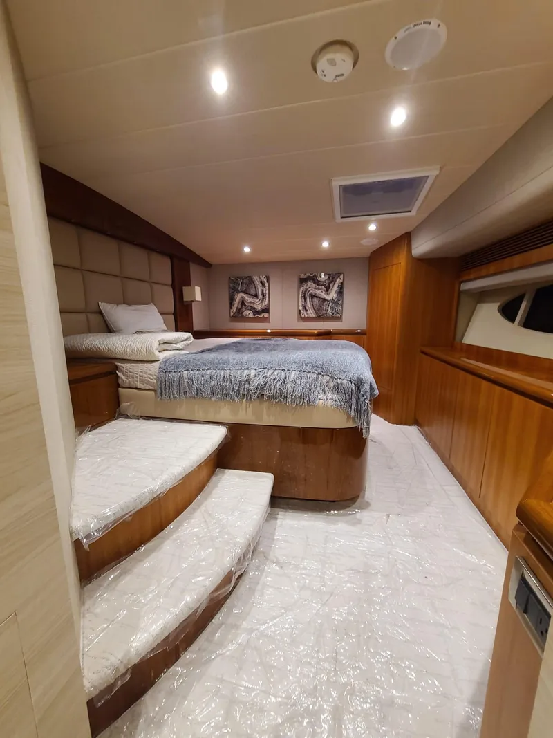 Slide: The Image of Luxurious cabin interior of a 2017 Horizon PC60 yacht with elegant wood paneling. - 6