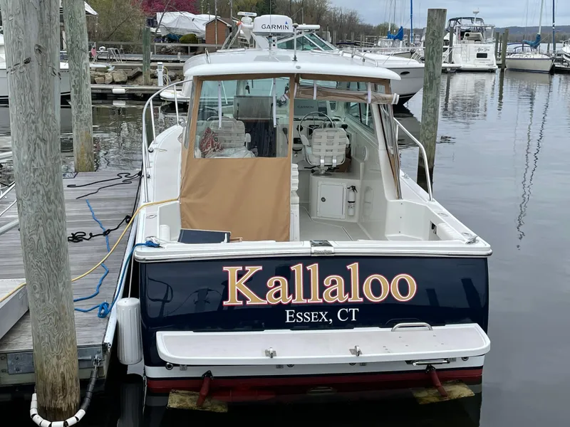 Slide: The Image of 2006 Back Cove 29 boat named "Kallaloo" docked in Essex, CT marina. - 12