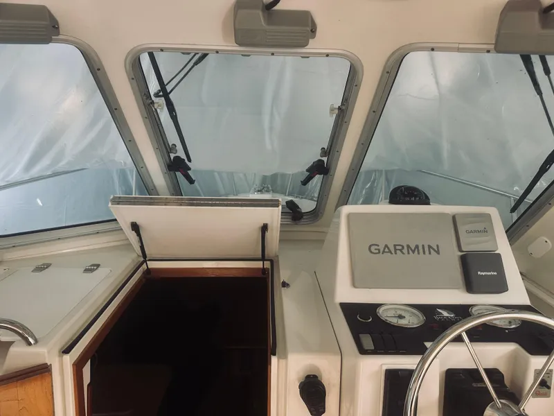 Slide: The Image of 2006 Back Cove 29 boat cockpit with Garmin navigation system. - 20