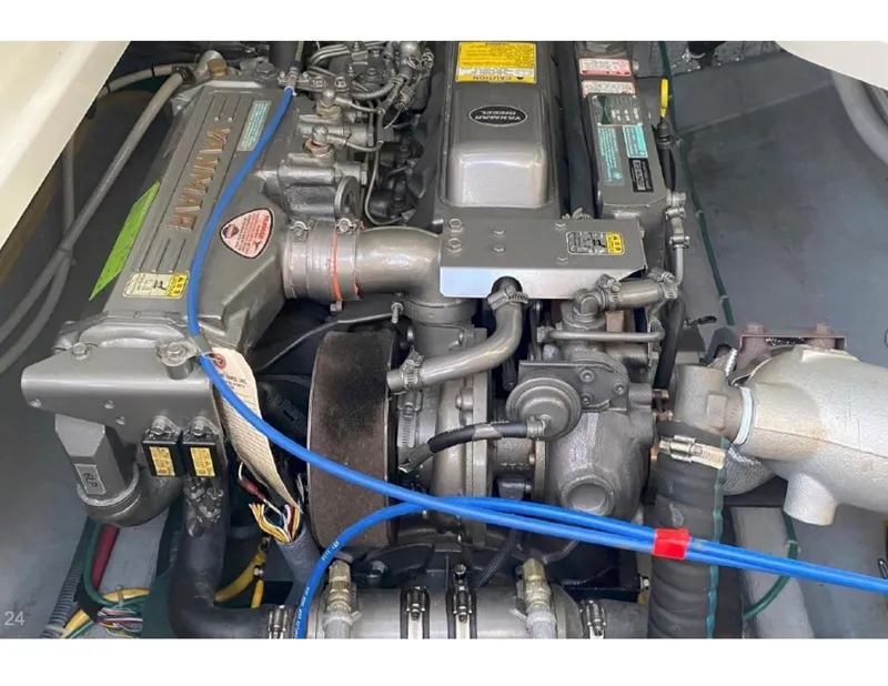 Slide: The Image of Engine compartment of a 2006 Back Cove 29 boat, showcasing detailed mechanical components. - 22
