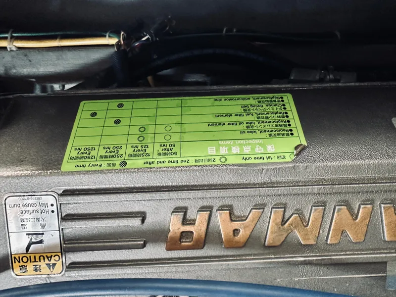 Slide: The Image of Engine compartment of a 2006 Back Cove 29 boat, featuring Yanmar branding. - 24