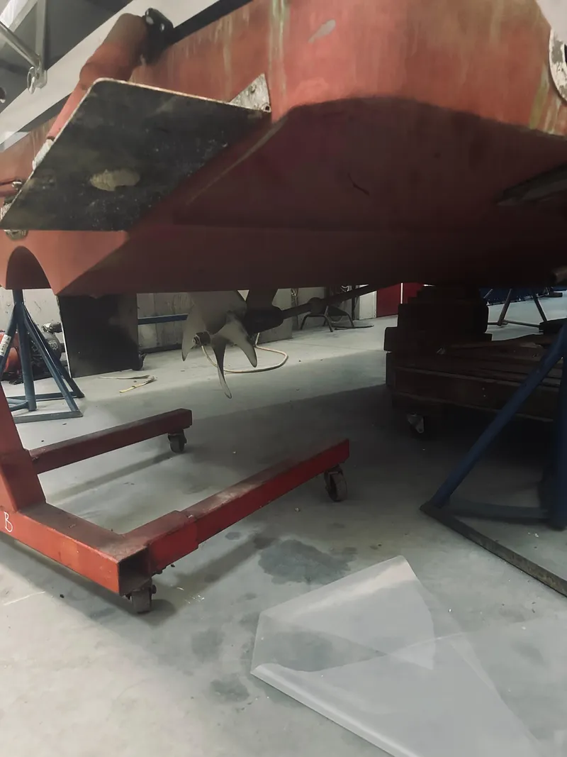 Slide: The Image of 2006 Back Cove 29 boat under maintenance in a workshop. - 28