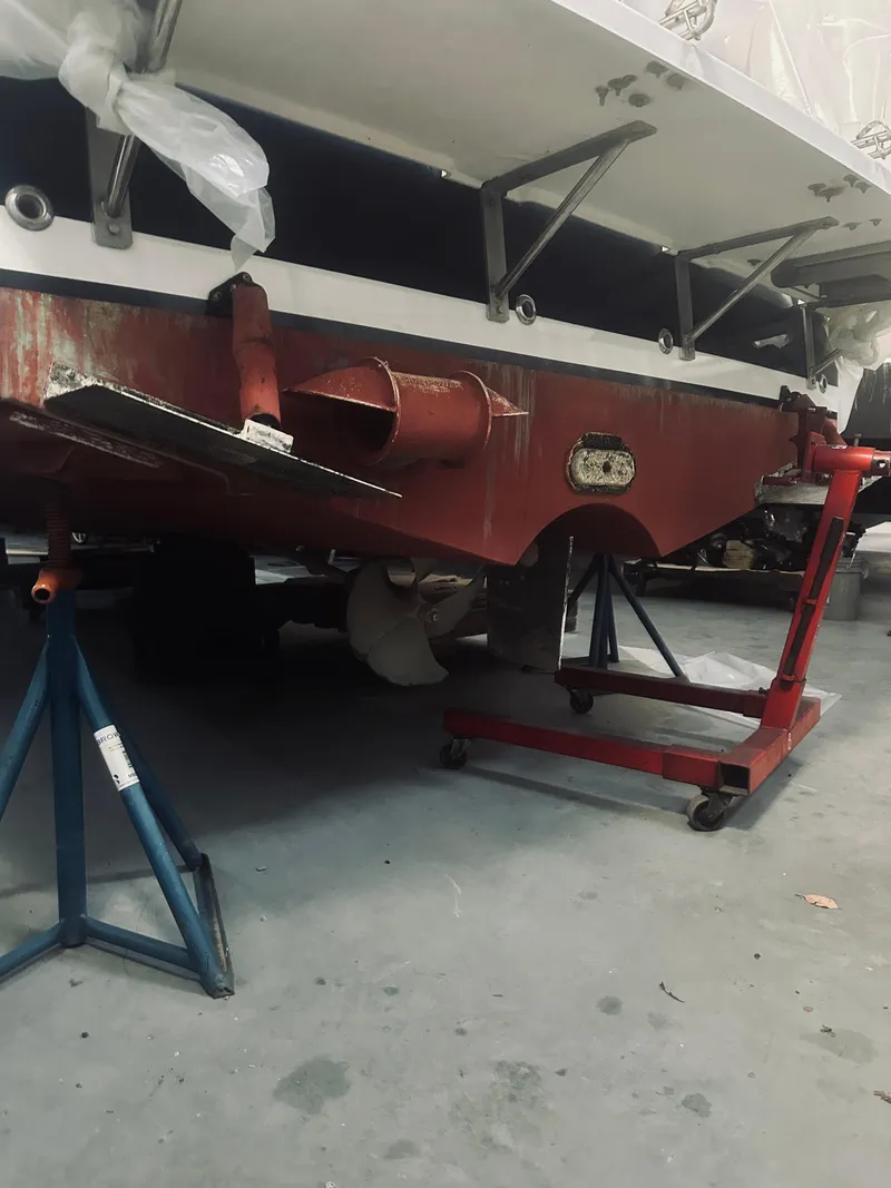 Slide: The Image of 2006 Back Cove 29 boat under maintenance in a workshop. - 30