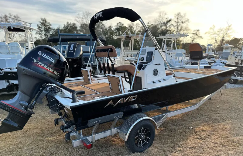 The Image of 2025 Avid Rogue 20 CC boat with Yamaha motor on trailer, parked outdoors. - 0