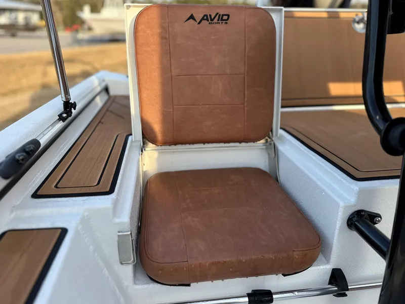 Slide: The Image of Brown seat on 2025 Avid Rogue 20 CC boat, featuring sleek design and comfort. - 7