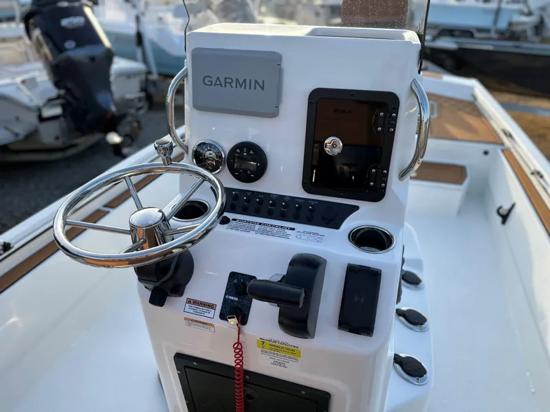 Slide: The Image of Center console of 2025 Avid Rogue 20 CC boat with Garmin navigation system. - 8