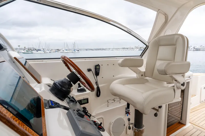 Slide: The Image of 2006 Chris-Craft Roamer 40 helm with leather seat and wooden steering wheel. - 13