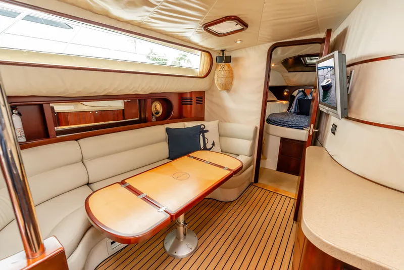 Slide: The Image of Luxurious interior of 2006 Chris-Craft Roamer 40 yacht with elegant seating and wood finishes. - 14
