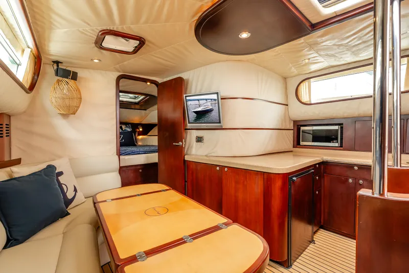 Slide: The Image of Luxurious interior of 2006 Chris-Craft Roamer 40 yacht with elegant seating and modern amenities. - 15