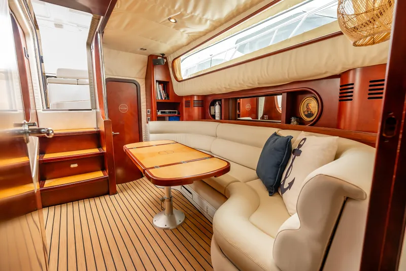 Slide: The Image of Luxurious 2006 Chris-Craft Roamer 40 yacht interior with elegant wood cabinetry and modern amenities. - 17