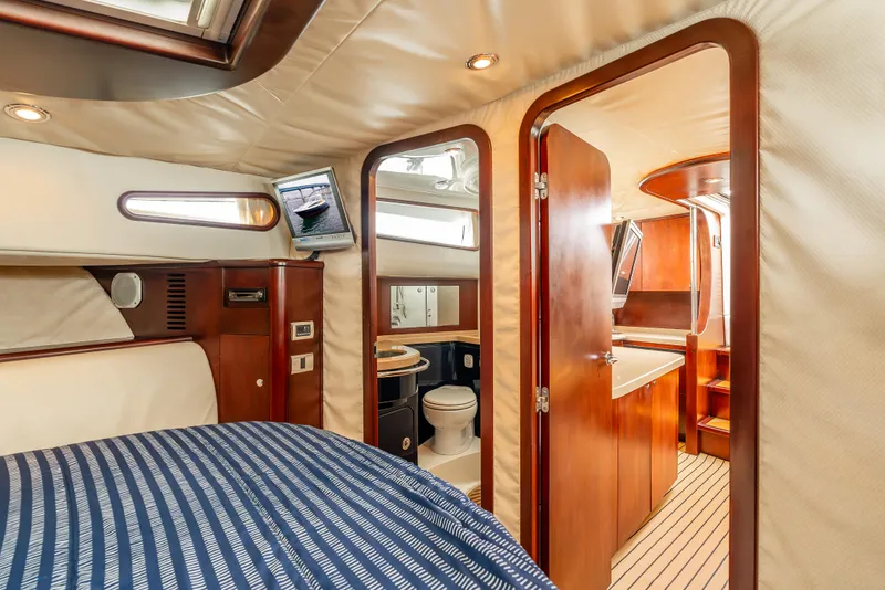 Slide: The Image of Luxurious interior of 2006 Chris-Craft Roamer 40 yacht with elegant wood finishes and plush seating. - 19