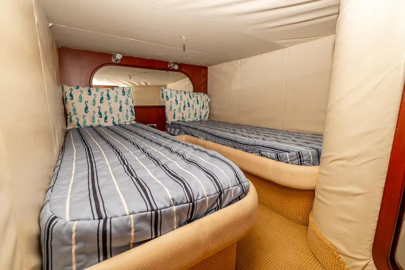 Slide: The Image of Luxurious cabin interior of 2006 Chris-Craft Roamer 40 yacht with elegant bedding. - 21