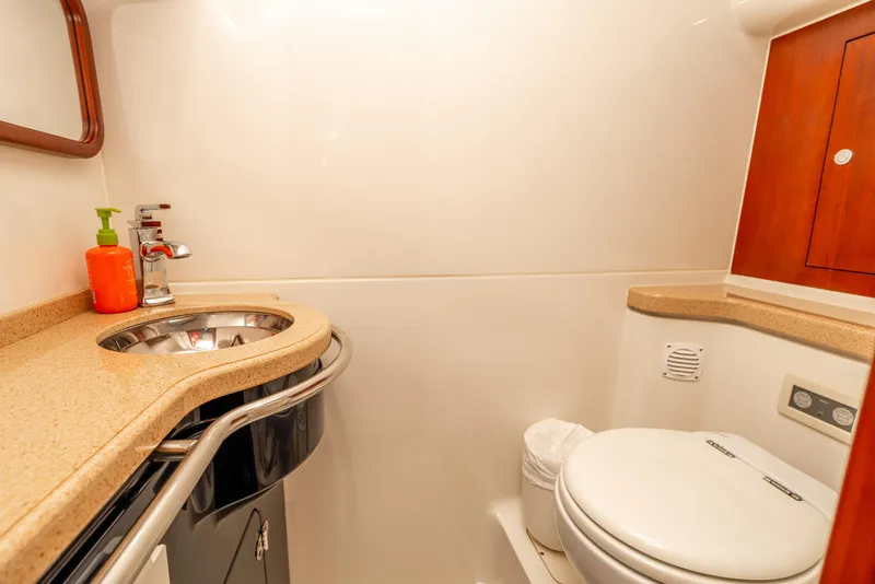 Slide: The Image of Luxurious interior of 2006 Chris-Craft Roamer 40 yacht with wood finishes and modern amenities. - 22