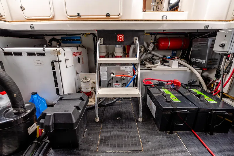 Slide: The Image of Interior cabin of 2006 Chris-Craft Roamer 40 with twin beds and striped bedding. - 24